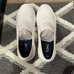 TOMS white canvas slip ons